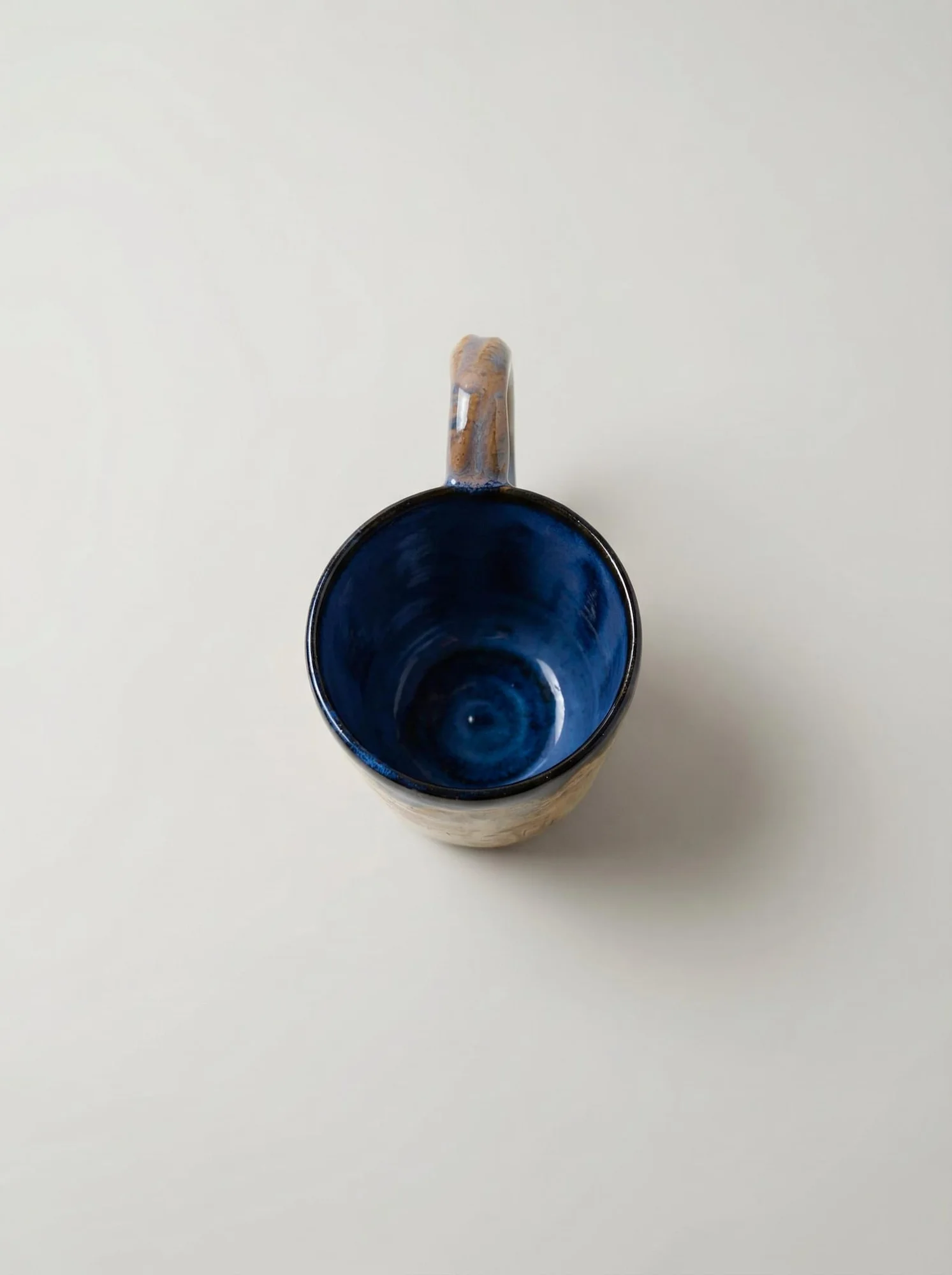 Blue Rim Earth Tone Drip Mug - detail view