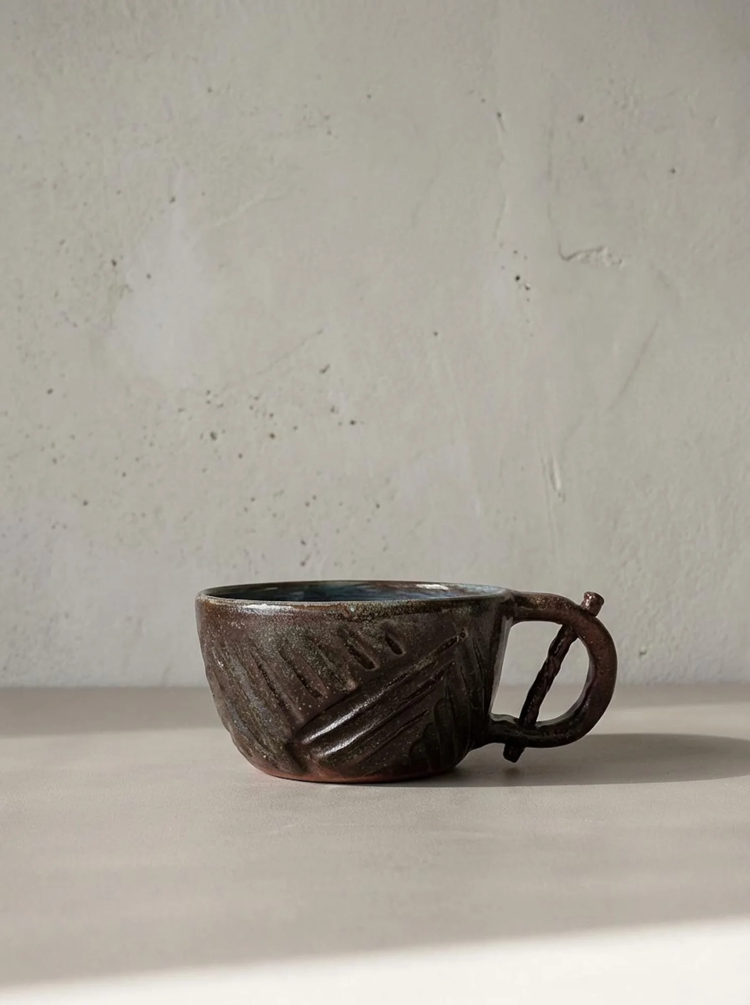Dark Brown Carved Mug - side view