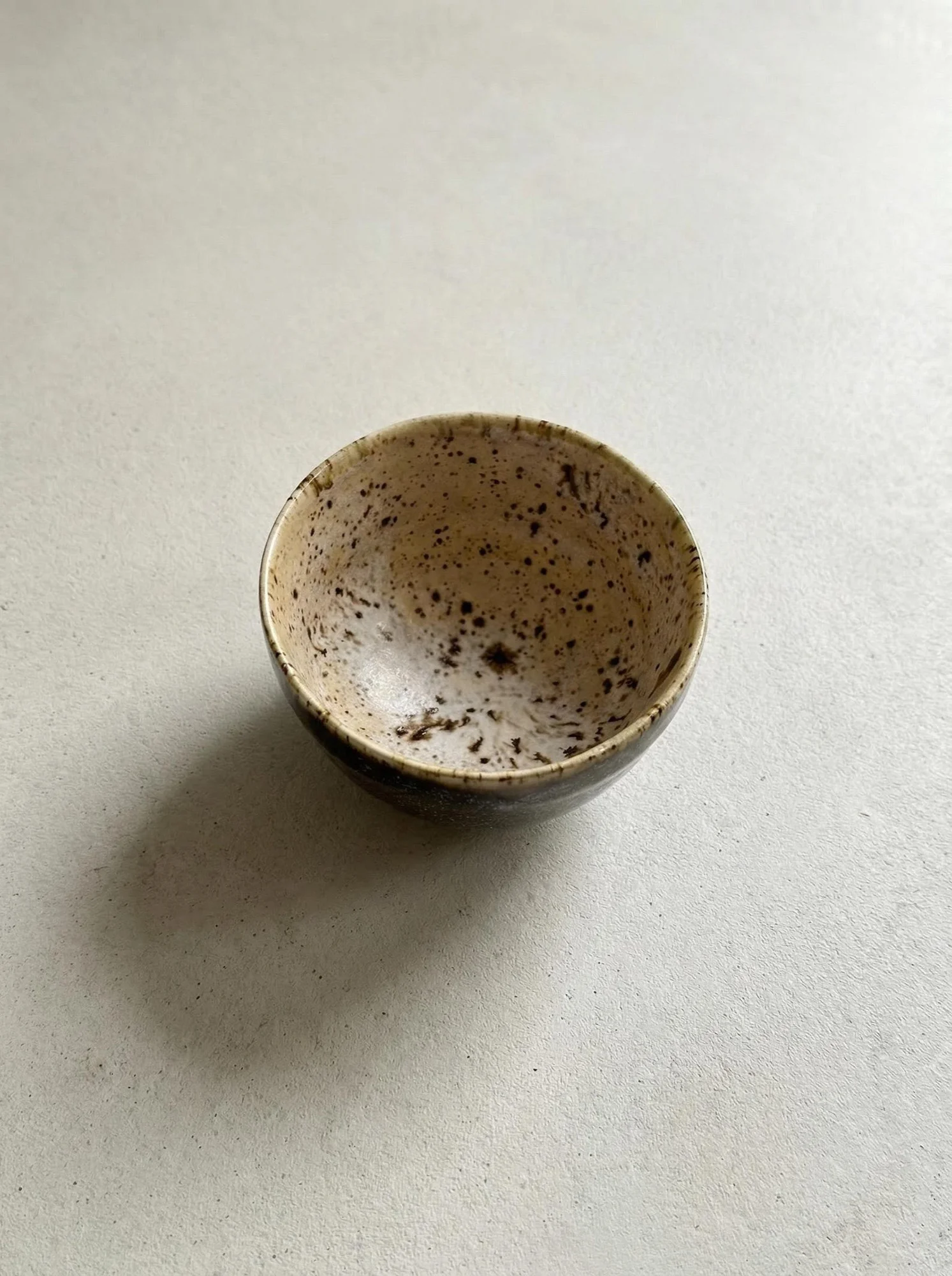 Speckled Cream Stone Tea Cup - front view