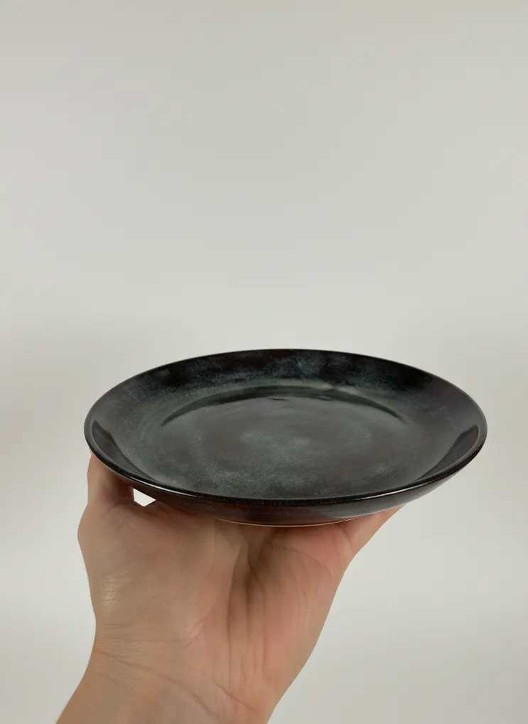 Midnight swirl ceramic dinner plate - hand hold