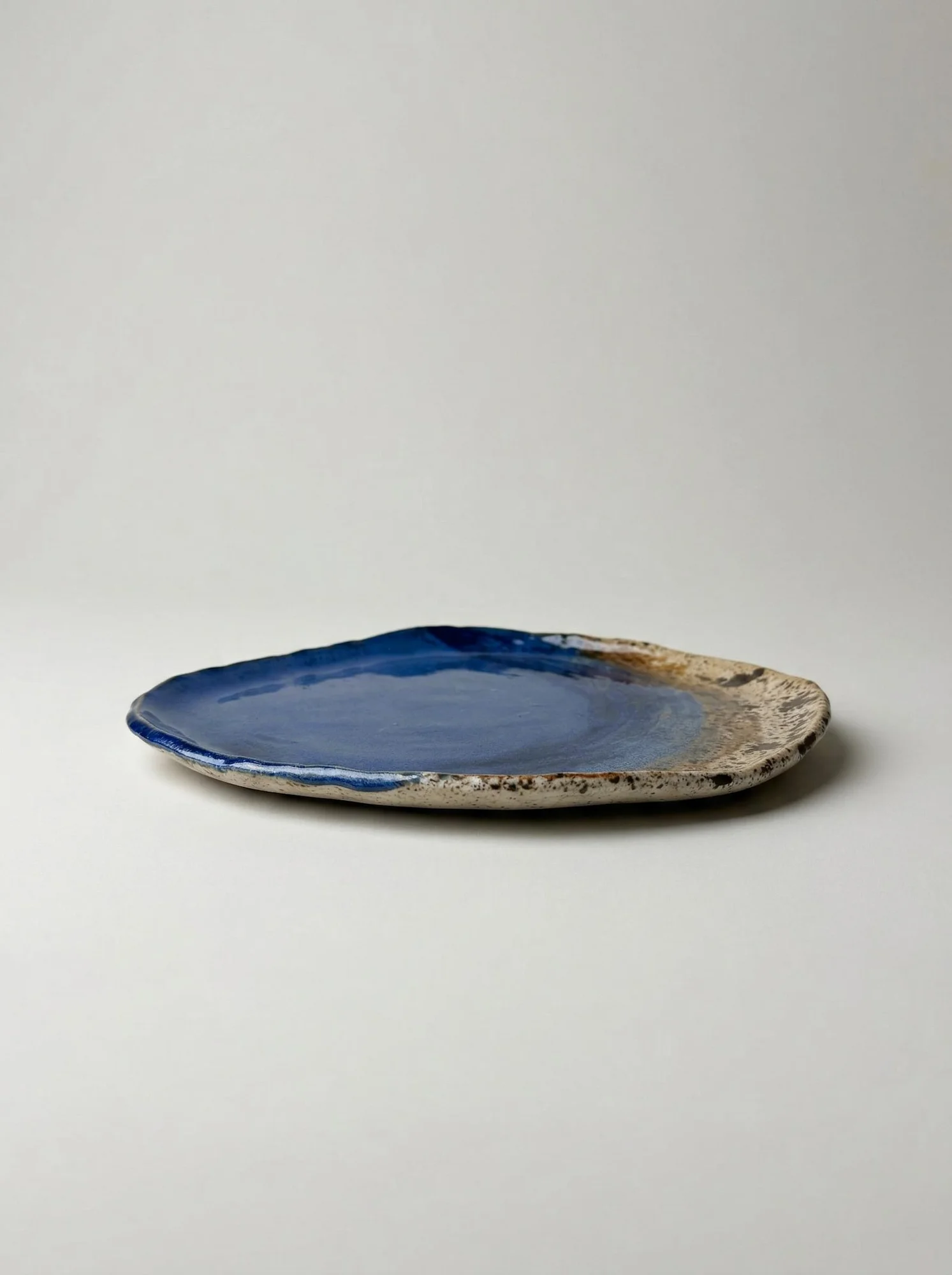 Ocean Blue Sandy Rim Plate - side view